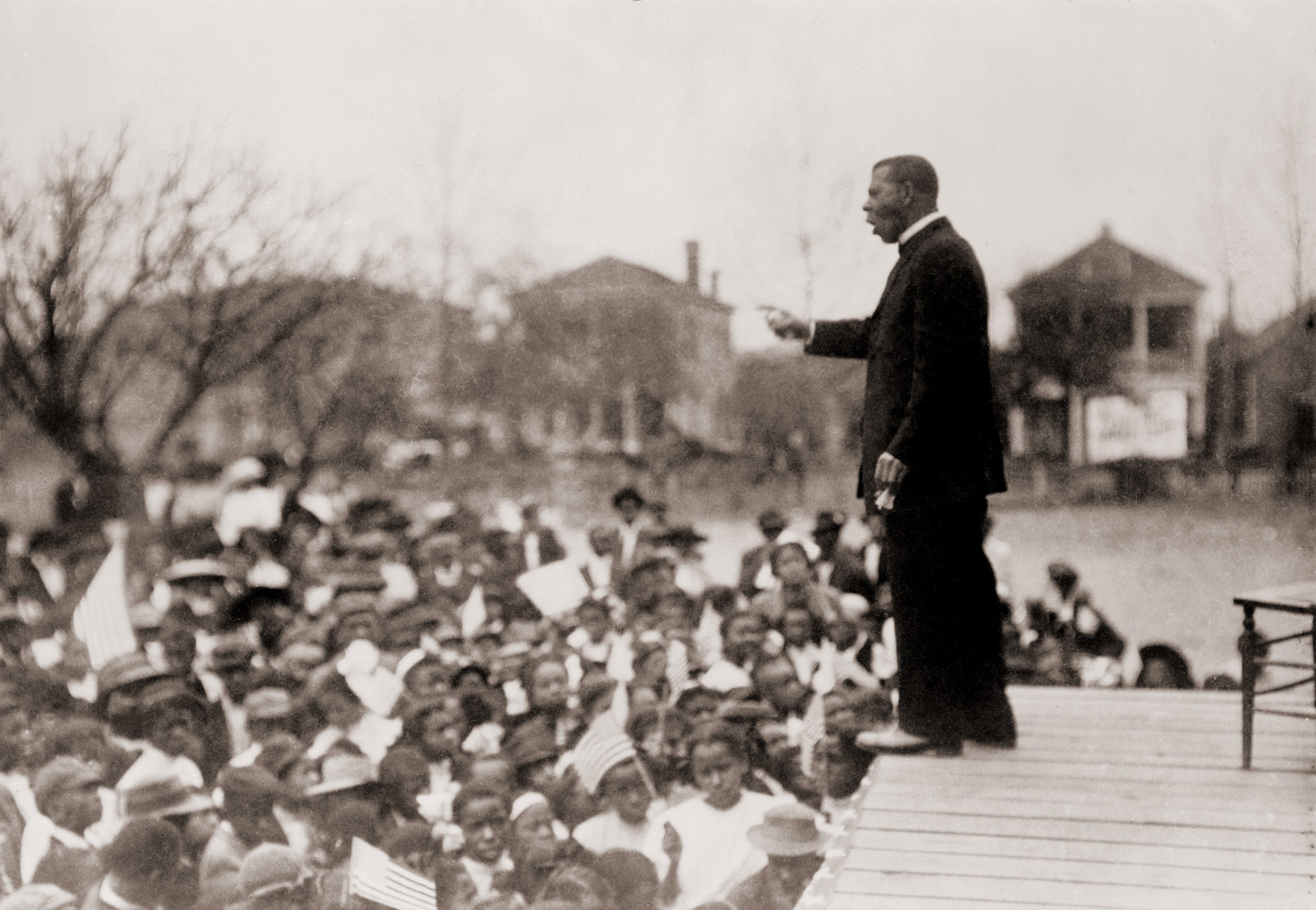 Booker T. Washington (1856-1915), speaking to an African American school children. While he was the best known African American leader of his day, he was criticized by younger leaders, such as W.E.B. DuBois, for not challenging the racist status quo of hi